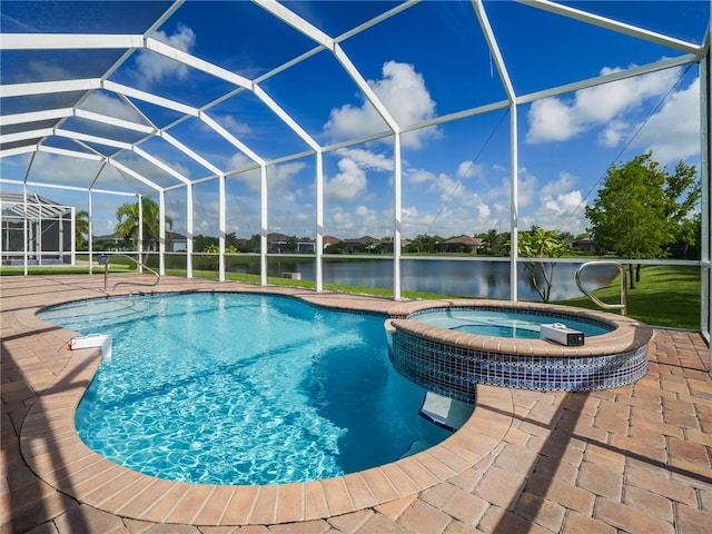 view of pool with a patio, a water view, a lanai, and an in ground hot tub