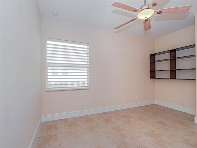 unfurnished room with ceiling fan