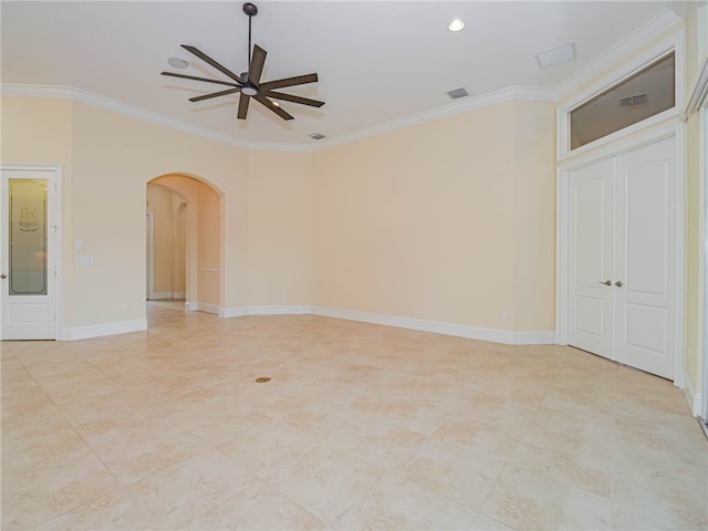 empty room with ceiling fan and crown molding