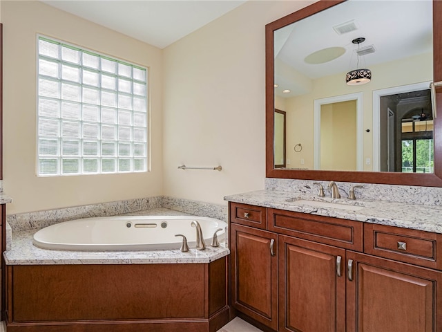 bathroom with a bath and vanity