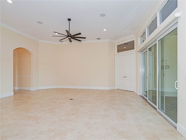 spare room featuring ceiling fan and ornamental molding