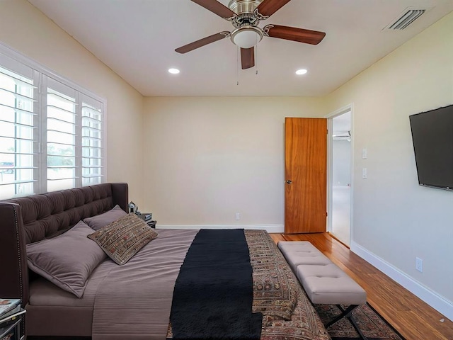 bedroom featuring ceiling fan and hardwood / wood-style floors