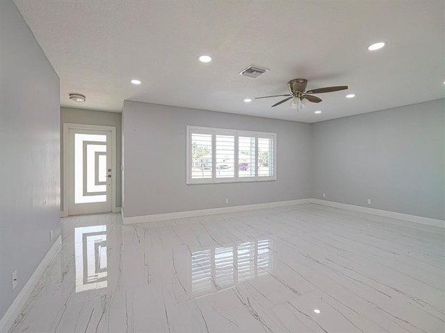 unfurnished room featuring ceiling fan