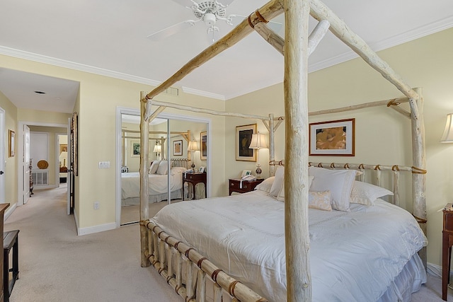 bedroom with ceiling fan, a closet, crown molding, and light colored carpet