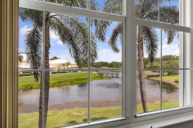 doorway to outside featuring a water view