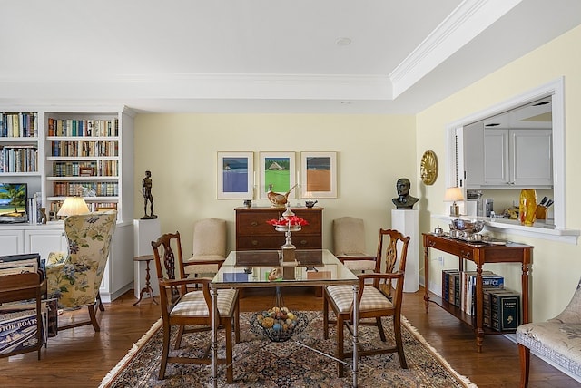 dining area with dark wood-type flooring and ornamental molding