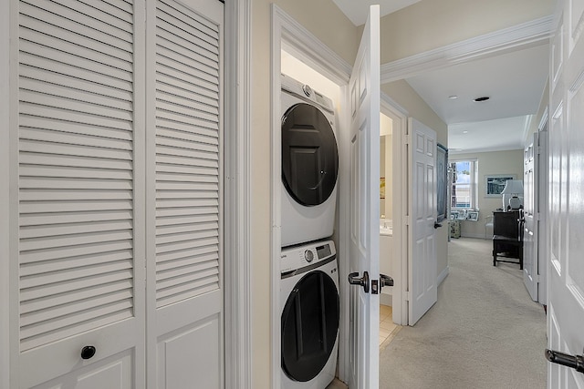 laundry area with stacked washing maching and dryer and light carpet