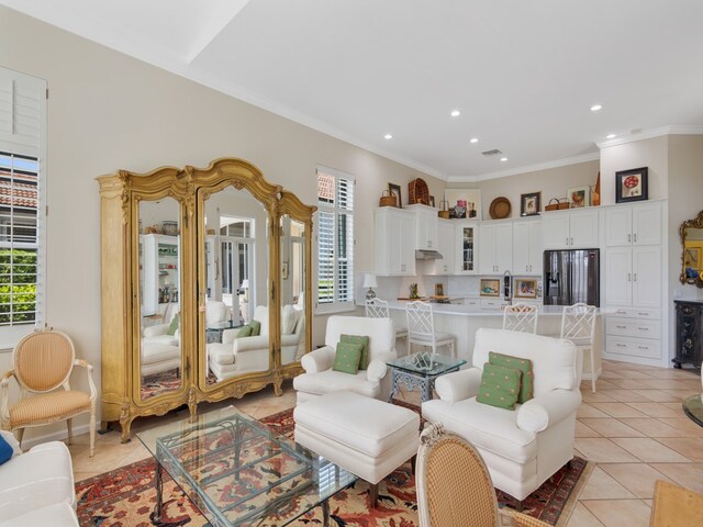 tiled living room with crown molding