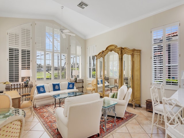 living room with vaulted ceiling, light tile patterned floors, ceiling fan, and crown molding