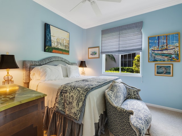 carpeted bedroom with ornamental molding and ceiling fan