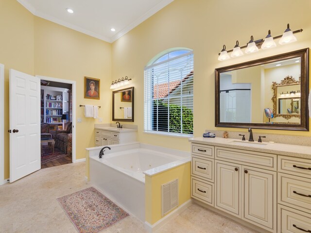 bathroom with a tub, vanity, and crown molding