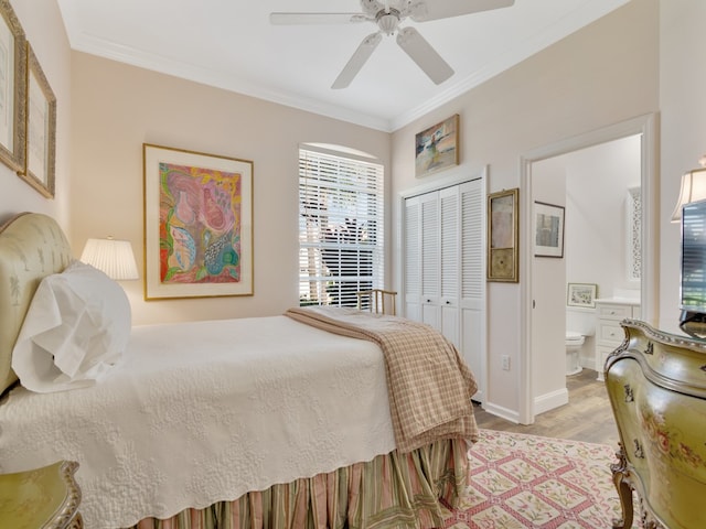 bedroom featuring light hardwood / wood-style floors, connected bathroom, ornamental molding, ceiling fan, and a closet