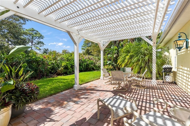 view of patio featuring grilling area and a pergola