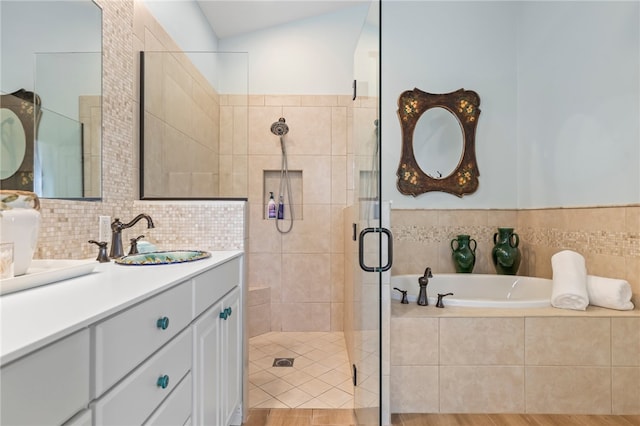 bathroom featuring vanity, wood-type flooring, and separate shower and tub