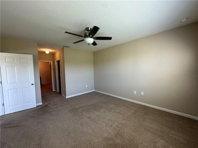 unfurnished room featuring baseboards, carpet, and a ceiling fan