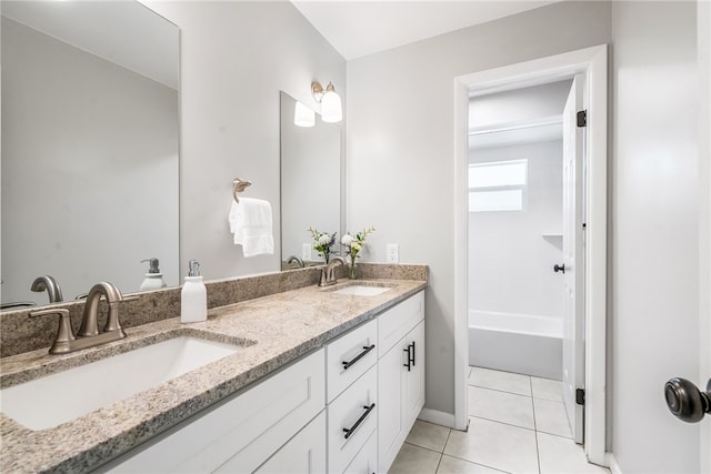 bathroom with tile patterned flooring, vanity, and bathtub / shower combination