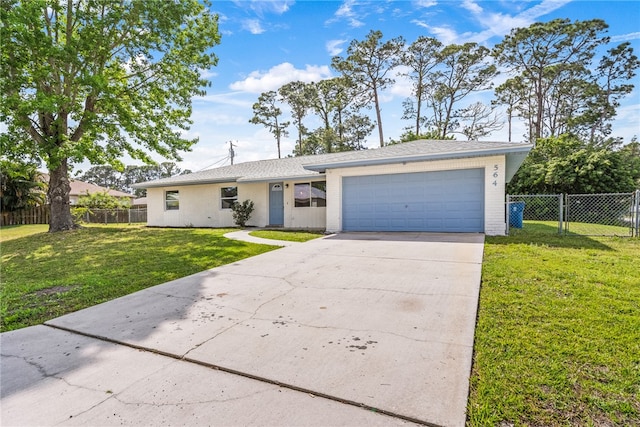 ranch-style house featuring a front lawn and a garage