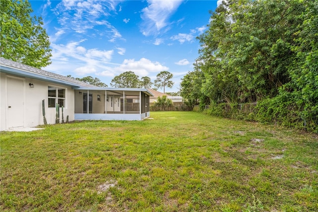 view of yard with a sunroom