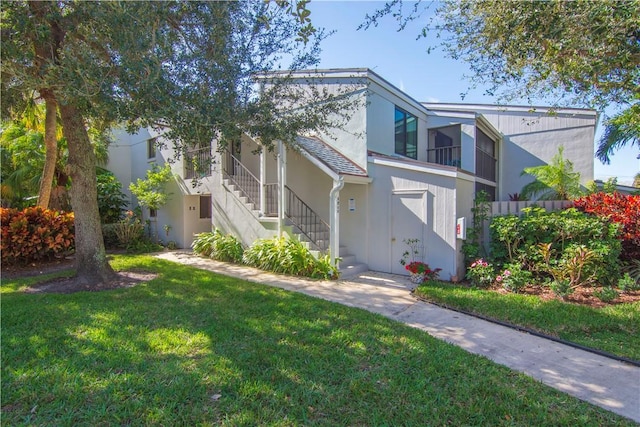 view of front of home with a front yard