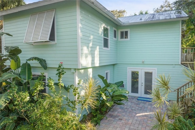 back of house with french doors and a patio