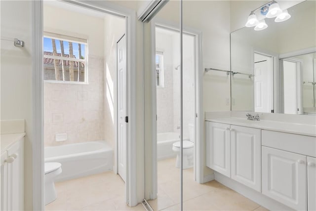 9520 E Maiden Ct, Vero Beach, FL 32963 - bathroom with toilet, vanity, and tile patterned flooring