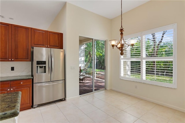 9520 E Maiden Ct, Vero Beach, FL 32963 - kitchen featuring stainless steel fridge with ice dispenser, a chandelier, and baseboards