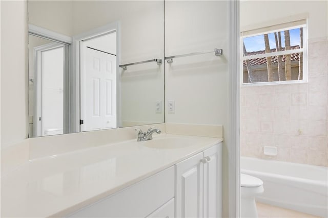 9520 E Maiden Ct, Vero Beach, FL 32963 - full bathroom with toilet, vanity, and tub / shower combination