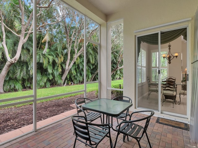 9520 E Maiden Ct, Vero Beach, FL 32963 - sunroom / solarium with outdoor dining area