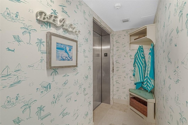 bathroom with heating unit, elevator, a shower, tile patterned floors, and a textured ceiling