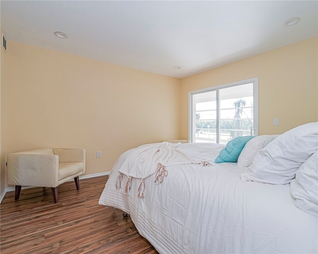 bedroom with wood-type flooring