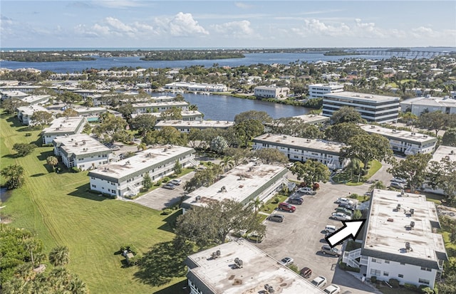 birds eye view of property with a water view