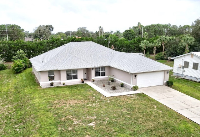 single story home with a front yard and a garage