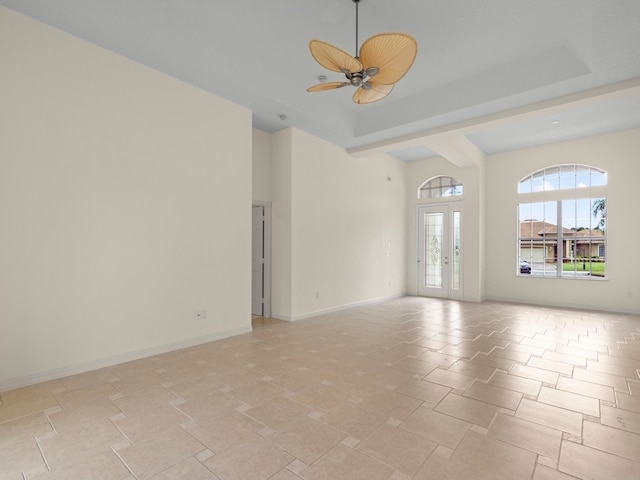 empty room featuring french doors and ceiling fan