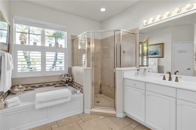 bathroom featuring vanity, tile patterned floors, and independent shower and bath