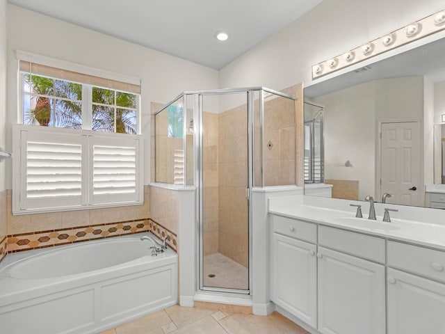 bathroom with vanity, tile patterned flooring, and shower with separate bathtub