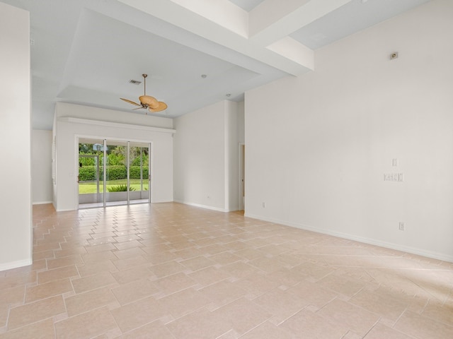 spare room with ceiling fan and light tile patterned floors