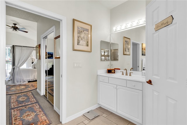 bathroom with vanity, ceiling fan, tile patterned floors, and vaulted ceiling