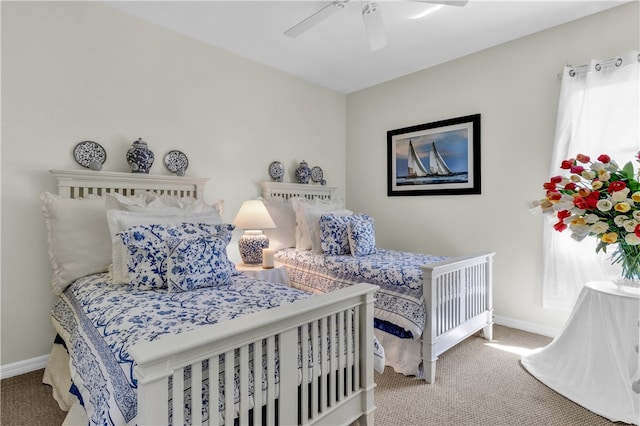 bedroom featuring multiple windows, ceiling fan, and carpet floors