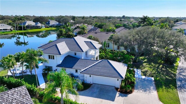 view of front of house with a water view