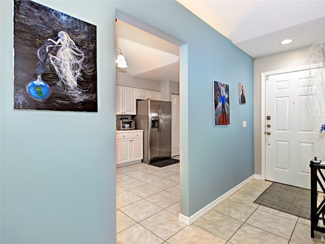 foyer entrance featuring light tile patterned floors