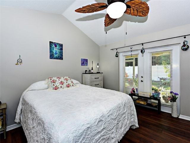 bedroom featuring ceiling fan, dark hardwood / wood-style floors, and vaulted ceiling