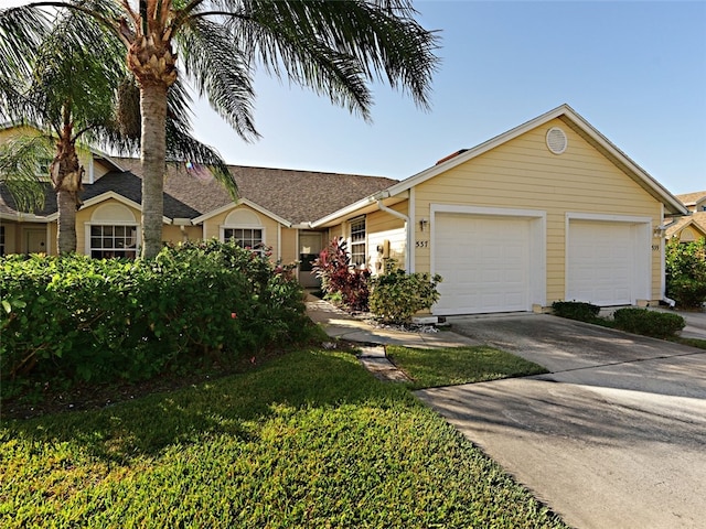 ranch-style house featuring a garage