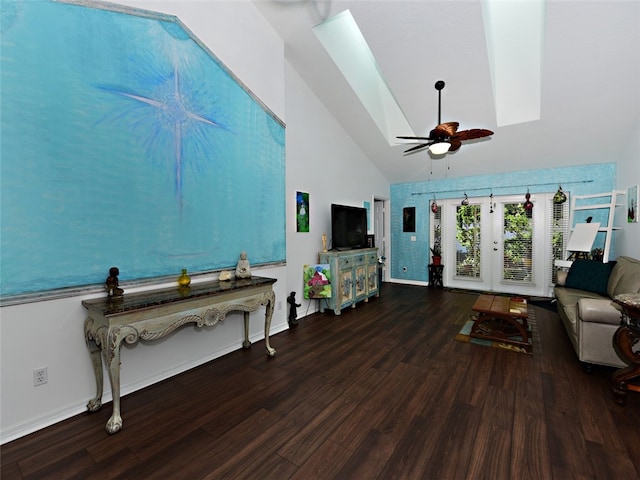 living room with hardwood / wood-style flooring, ceiling fan, high vaulted ceiling, and a skylight