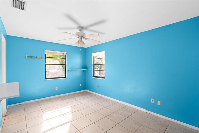 bedroom featuring ceiling fan and light tile patterned floors