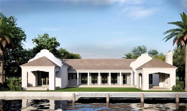 524 Bay Dr, Vero Beach, FL 32963 - rear view of property with stucco siding and a chimney