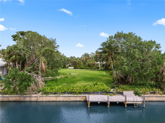 524 Bay Dr, Vero Beach, FL 32963 - dock area with a yard and a water view