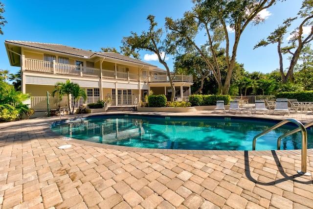 view of swimming pool with a patio