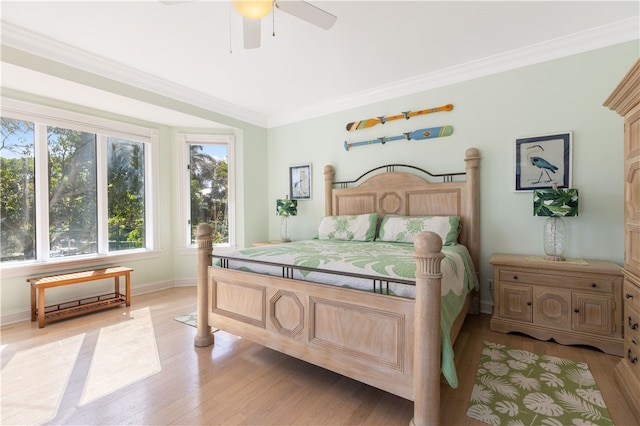 bedroom featuring crown molding, ceiling fan, and light hardwood / wood-style floors