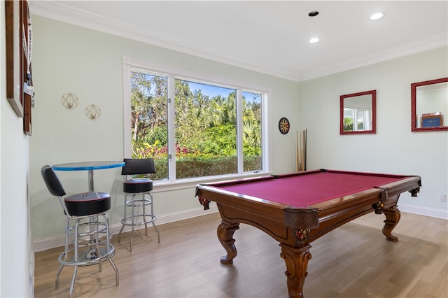 game room with crown molding, light hardwood / wood-style flooring, and billiards