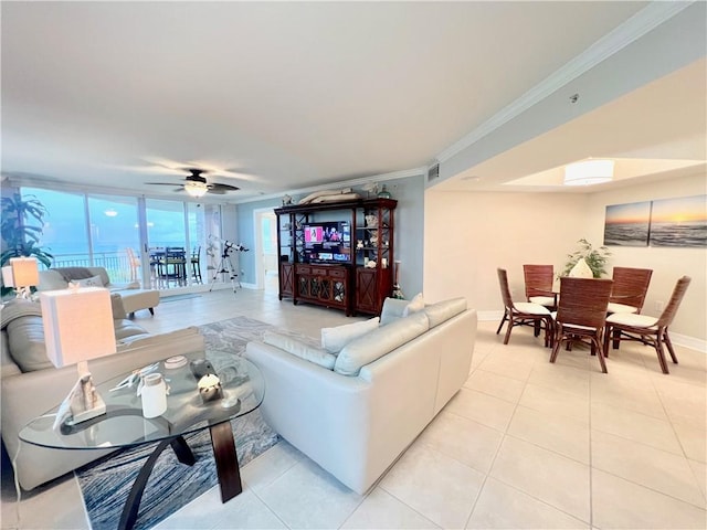 tiled living room featuring ceiling fan and crown molding